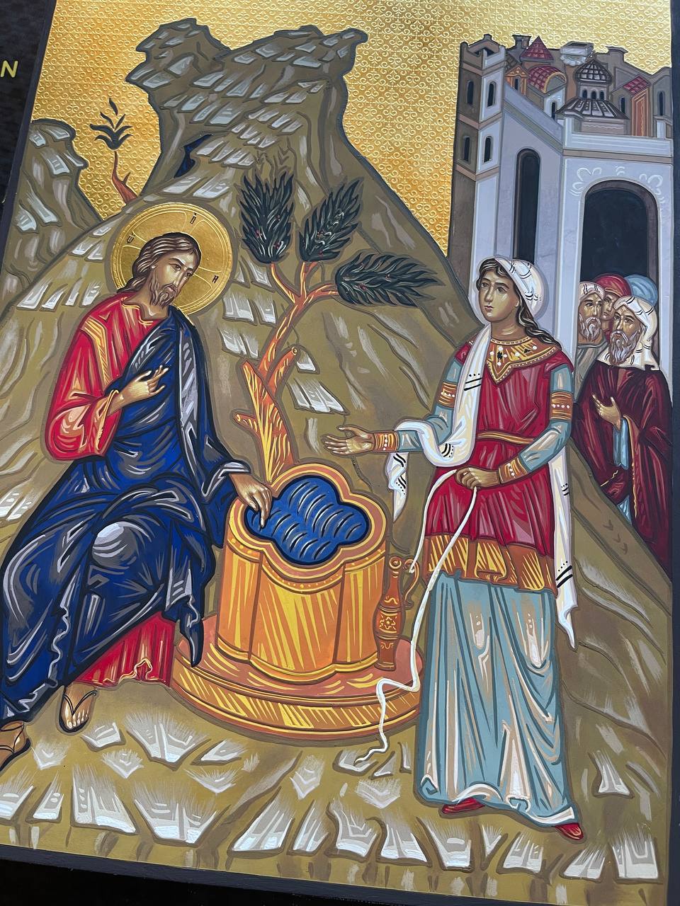 Jesús hablando con la mujer samaritana.