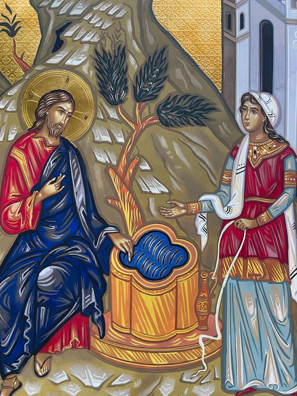 Jesús hablando con la mujer samaritana.